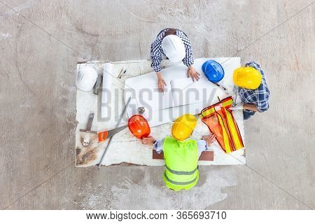 Manager And Engineer Work As Teamwork Together At Industrial Construction Site For Meeting And Conce