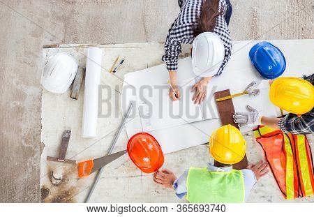 Manager And Engineer Work As Teamwork Together At Industrial Construction Site For Meeting And Conce