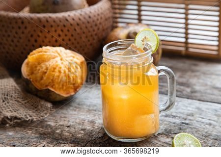 Exotic Fruit Juice From Bel Fruit Or Wooden Apple Called In India Bel Ka Sharbat. Cold Fruit Drink W