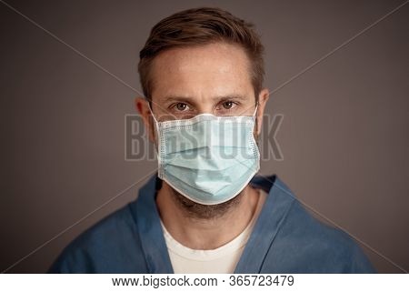Stop The Spread And Save Lives Campaign. Male Doctor Wearing Protection Face Mask. Protect Yourself 