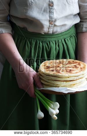 Woman Holding In Her Hands Traditional In Different Countries Pies Stuffed With Cheese And Herbs And