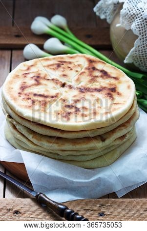 Traditional In Different Countries Pies Stuffed With Cheese And Herbs, Fresh Garlic And Wine On A Wo