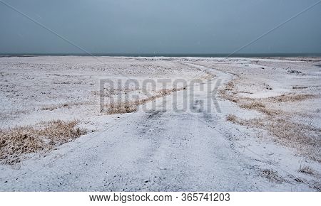Empty Secondary Rural Frozen Road Leading To The Ocean. Snæfellsnes Peninsula Iceland