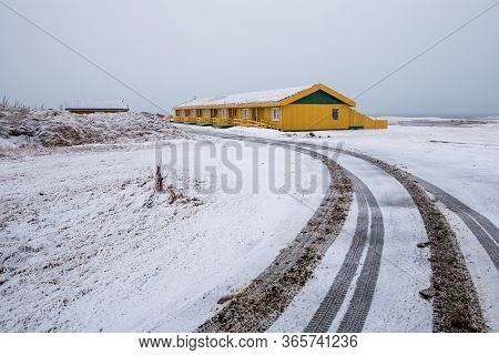 Empty Road Leading To A Holiday Resort In Winter At Snæfellsnes Peninsula In Iceland