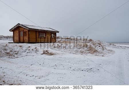 Wooden Holiday Chalet In Winter At Snæfellsnes Peninsula In Iceland