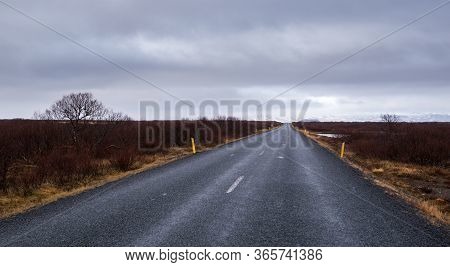 Highway Countryside Straight Empty Road Leading To The Snowy Mountains At Snæfellsnes Peninsula In I