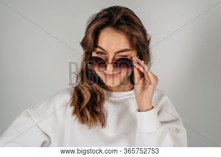Close-up Porttrait Of Young Smiling American Woman In Sun Glasses, Isolated On White Background