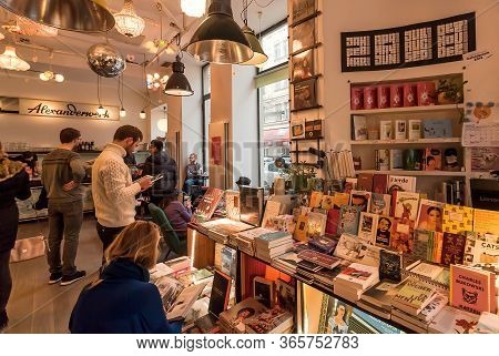 Vienna, Austria: Young People And Students Reading New Books And Drinking Coffee Inside Popular Cafe