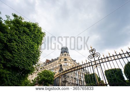Paris. France - May 17, 2019: Beautiful Old Building Located at the Crossroads of Rue Auguste Comte and Avenue de L' Observatoire Streets in Paris, France. Entrance Gate of Luxembourg Gardens.