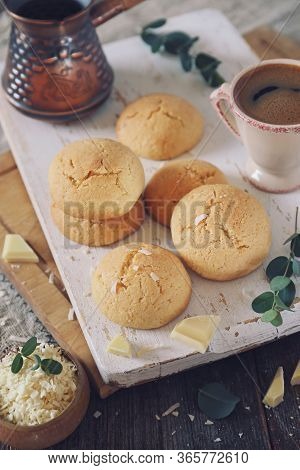 Coconut Cookies With White Chocolate And  Cup Of Coffee. Toned Image