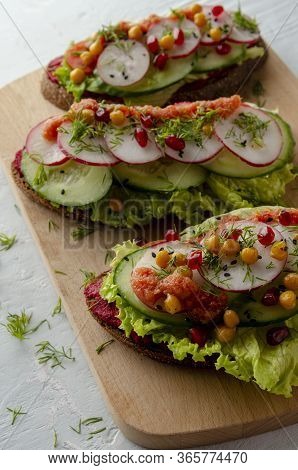 Open Sandwich With Beetroot Hummus With Vegetables And Tomato Sauce. Healthy Vegan Food Concept.