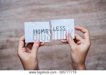 Man Hand Holding White Paper With The Text Homeless Change Word To Home. Positive Attitude, Crisis, 