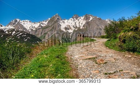 Mountain Path With Snowy Peak In Background, Formazza Valley In Summer Season