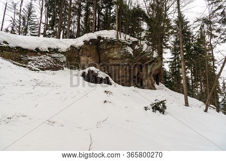 Sandstone Rock Formation In Winter Forest With Snow - Dorkowa Skala Near Przelecz Szarcula In Beskid