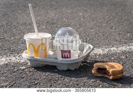 Slany, Czech Republic - April 5, 2020: Garbage Of Mcdonald's Fast Food On Asphalt Parking Lot