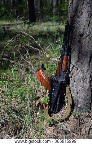 AKMS (Avtomat Kalashnikova) version of Kalashnikov assault rifle in the forest. May 11, 2020 Near Kiev ,Ukraine