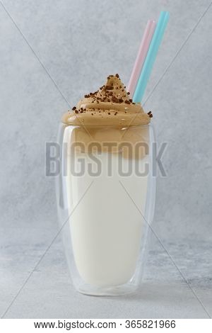 Dalgona Coffee In Tall Glass. A Double Walled Glass With Fluffy Creamy Whipped Dalgona Coffee Decora