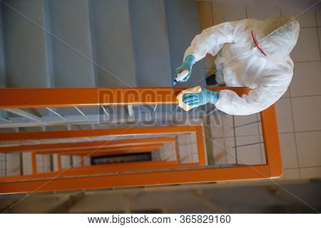 Concept Coronavirus Disinfection. People In Hazmats Making Cleaning In Stairwell Of Apartment Buildi