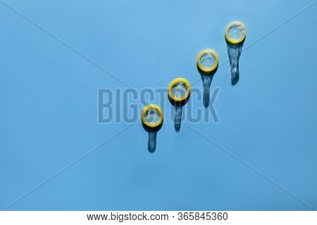 Group Of A Condom On A Blue Background, Flat Lay