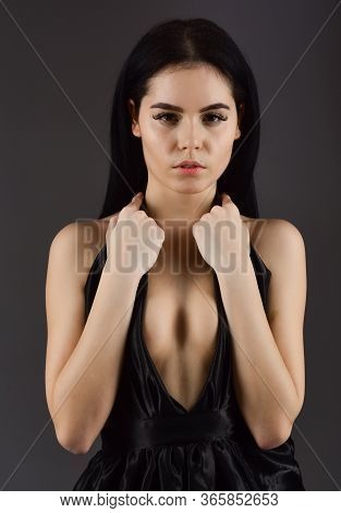 Attractive Girl Wears Expensive Fashionable Evening Dress With Erotic Decolette. Desire Concept. Wom