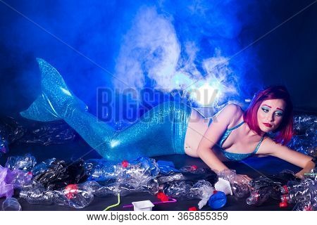 Ocean Plastic Pollution Concept. Mermaid Scared Due To Polluted Habitat.