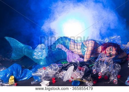 Ocean Plastic Pollution Concept. Mermaid Scared Due To Polluted Habitat.