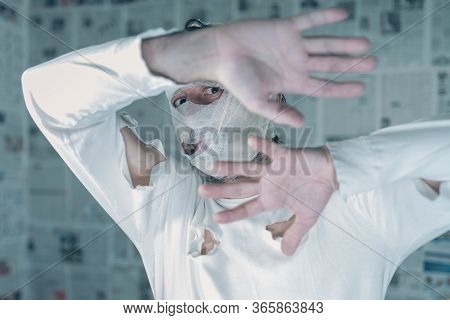Victim Of Tabloid Journalism And Fake News Infodemic, Conceptual Image Of Man Wrapped In Bandages Su