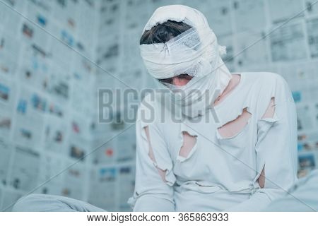 Victim Of Tabloid Journalism And Fake News Infodemic, Conceptual Image Of Man Wrapped In Bandages Su