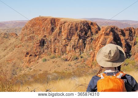 Backpacker Looking Out Over Cliffs At Trephina Gorge, Northern Territory, Australia 2017