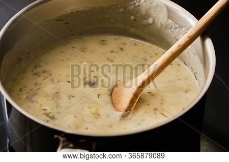 Preparing Tasty Czech Traditional Kulajda Soup In Cooking Pot