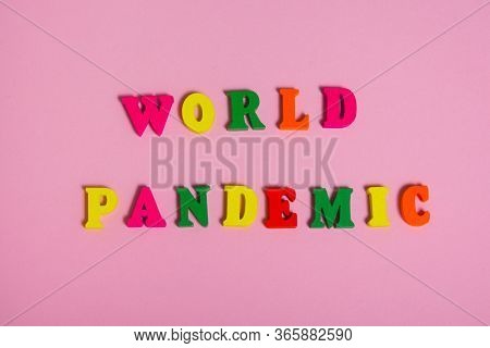 Word World Pamdemic  Assembled From Multi  Colored Letters On A Pink Background .