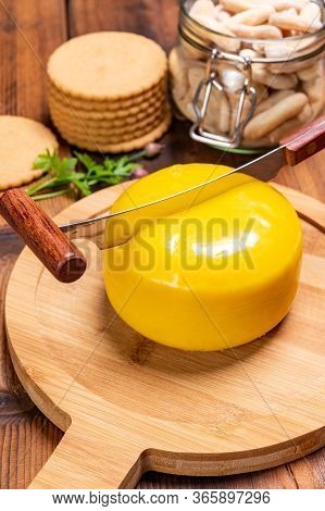 Dutch Baby Gouda Cheese In Yellow Wax Close Up