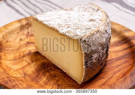 Pieces Of Cheese Tomme De Montagne Or Tomme De Savoie Made From Cow Milk In French Alps.