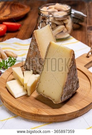 Pieces Of Cheese Tomme De Montagne Or Tomme De Savoie Made From Cow Milk In French Alps.