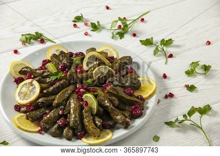 Stuffed Vine Leaves. Cherry And Lemon Leaf Wrapping, Stuffed. Traditional Turkish Stuffed Leaf Wrapp