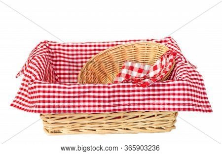 Wicker Basket With A Red Cotton Napkin Inside And A Small Wicker Basket Isolated On White Background