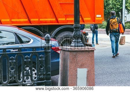 Moscow, Russia - July 7, 2017: An Adult Man In Blue Jeans Crosses The Road In The Wrong Place. Dange