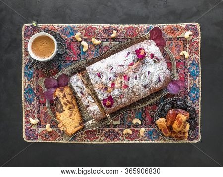 Ramadan Sweets. Honey And Date Cake On A Black Background. Top View.