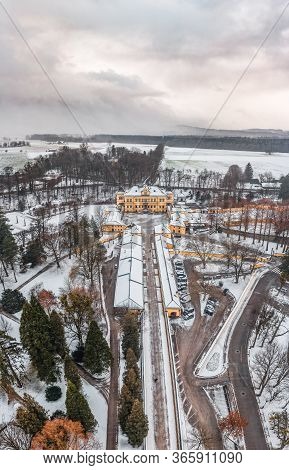 Aerial View Of Schloss Hellbrunn Covered In Snow View Of Snow Mountain Untersberg Near Salzburg Outs