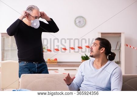 Father and son in coronavirus disease concept at home
