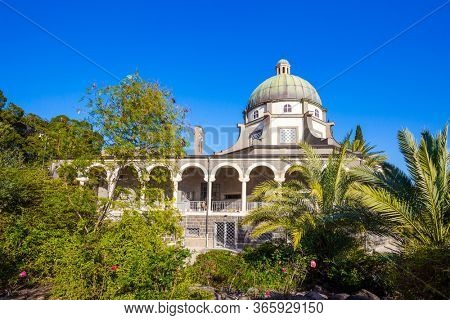 The Catholic Church of the Beatitudes of the Italian Franciscan monastery on Mount Bliss. The Sea of Galilee. Blooming huge park around the monastery. Israel. The concept of religious pilgrimage 