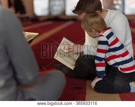 muslim people in mosque reading quran together concept of islamic education and school of holly book kuran