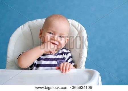 Happy Baby. Funny Smiling Little Cutest Chubby Caucasian White Infant Child Looking At Camera On Hig