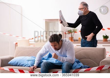 Father and son in coronavirus disease concept at home