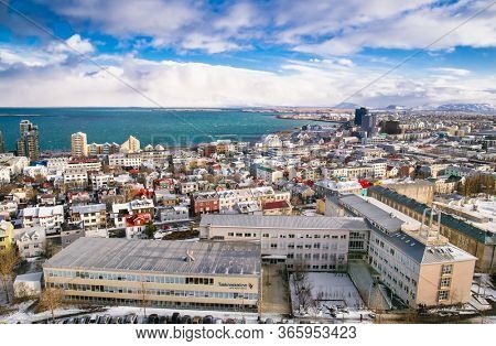 Reykjavic , Iceland- Feb 20, 2020:  Panoramic view of Reykjavik city and Atlantic ocean coast from the top of Hallgrimskirkja church. Reykjavik is the capital and largest city of Iceland.
