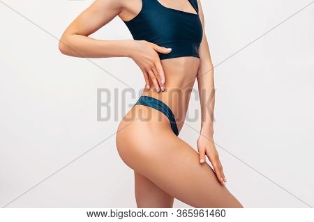 Unrecognizable Fit Woman In Black Lingerie On White Background Isolated. Muscular Slim Attractive Fe