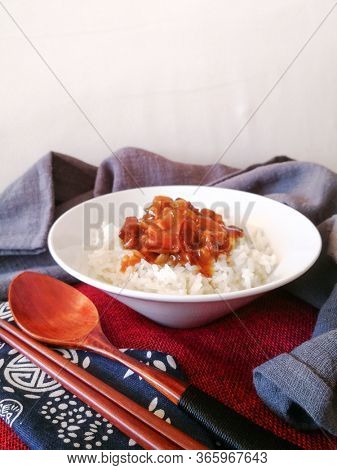 Asian style caramel pork with rice and vegetable