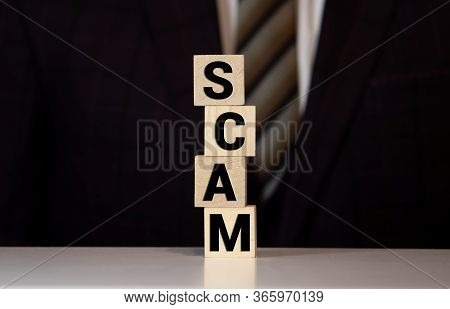 Wooden Blocks With The Text: Scam