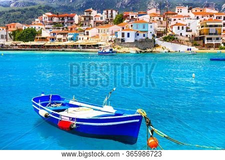 Traditional greek fishing villages. Beautiful Kokkari in Samos island. Popular tourist destination 