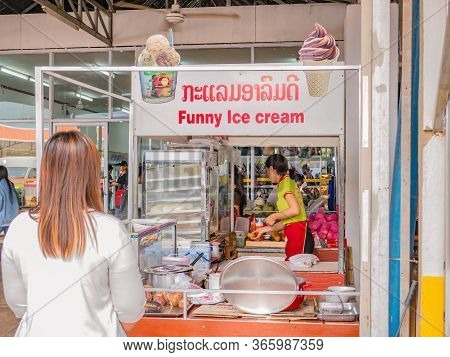 Vientiane/lao-4 Dec 2017:unacquainted People Have A Lunch In The Bus Stop Station Restaurant Between
